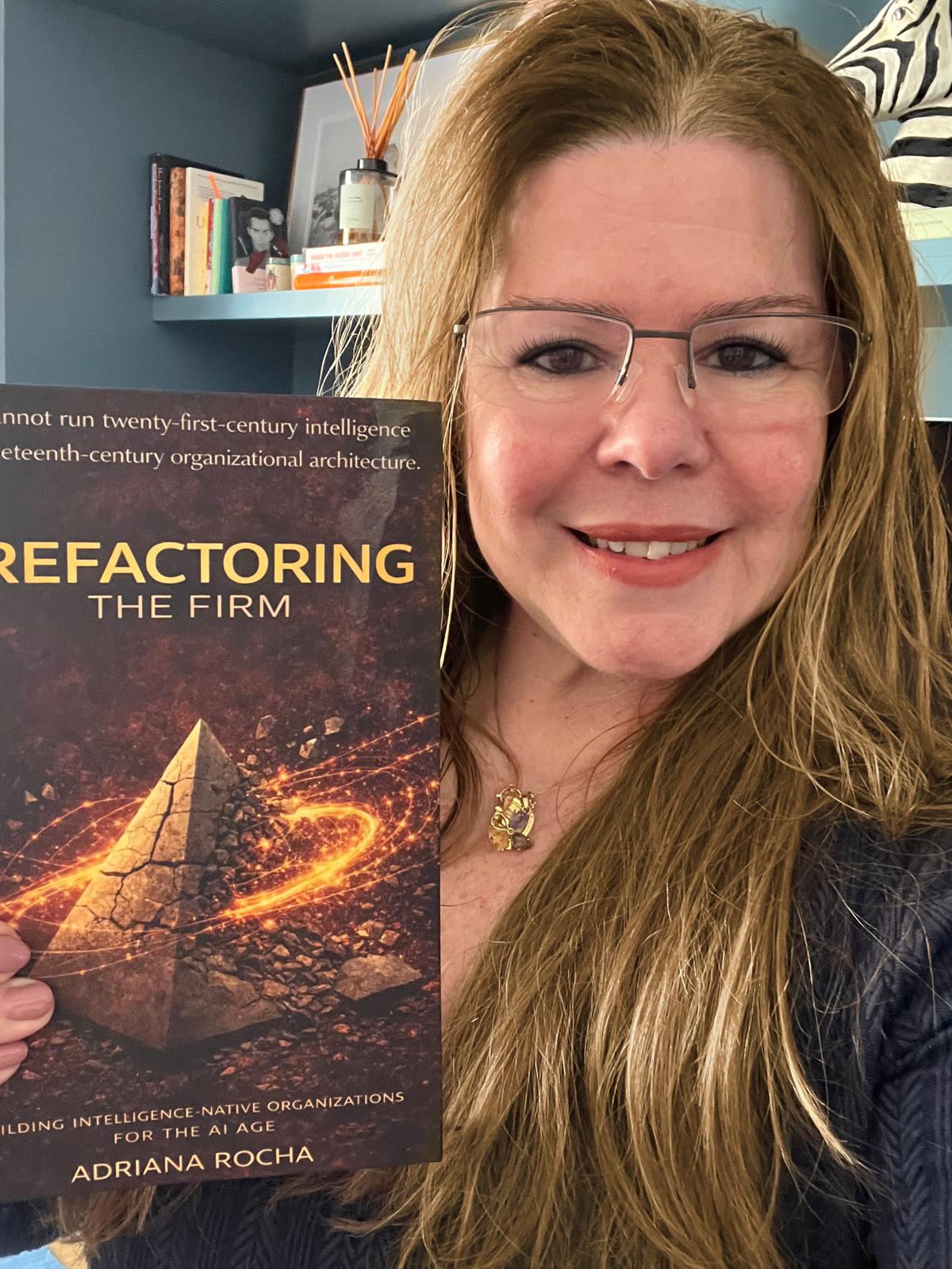 Adriana Rocha holding Refactoring the Firm